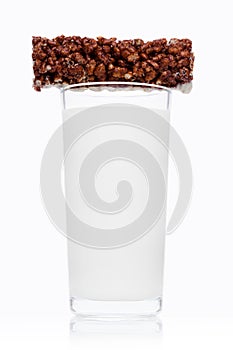 Glass of fresh breakfast milk with choc cereal bar