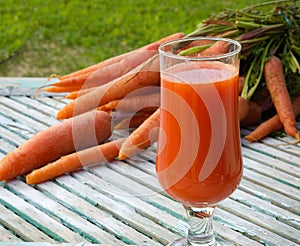 A glass of fresh carrot juice