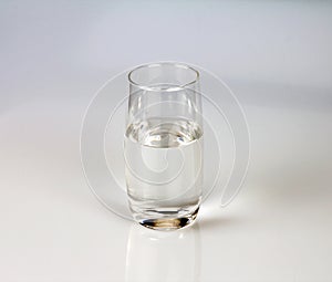 Glass of fresh drink water on grey backgrund