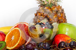 Glass with fresh fruit salad juices and dried fruits healthy