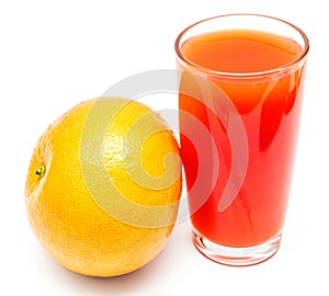 A glass of fresh grapefruit juice and grapefruit