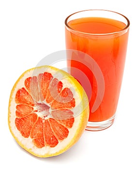 A glass of fresh grapefruit juice and grapefruit slice