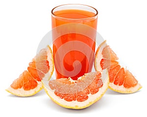 A glass of fresh grapefruit juice and grapefruit slice