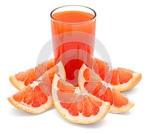 A glass of fresh grapefruit juice and grapefruit slice