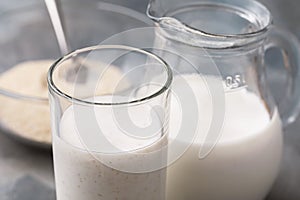 A glass of fresh kefir with oat bran, close-up. Concept of useful dairy products for the human digestive system