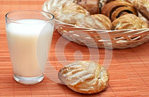 Glass with fresh milk and puff pastry