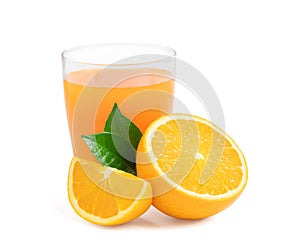 Glass of fresh orange juice with fruits cut in half and sliced with green leaf isolated on white background