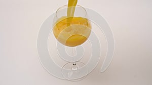 Glass of fresh squeezed Orange Juice - slow motion