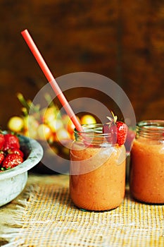 Glass of fresh strawberry nonalcoholic cocktail with berries.