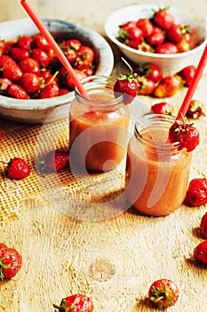 Glass of fresh strawberry nonalcoholic cocktail with berries.