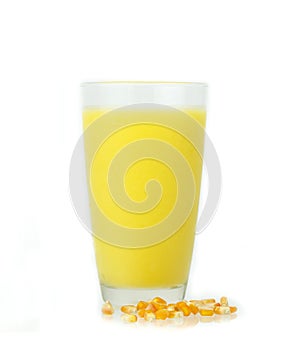 Glass of fresh sweet corn juice with corn grain