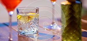 Glass of fresh water with lemon on table