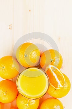 Glass of freshly pressed orange juice with oranges