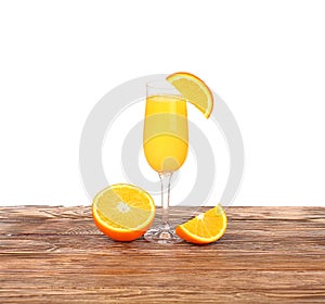 Glass of freshly pressed orange juice with sliced orange half on wooden table