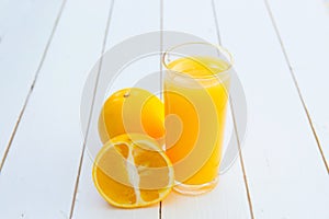 Glass of freshly pressed orange juice on wooden table