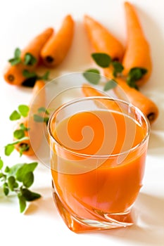 Glass of freshly squeezed carrot juice photo