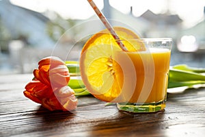 Glass of freshly squeezed orange juice photo