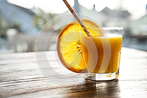 Glass of freshly squeezed orange juice photo