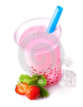 Glass of frothy strawberry bubble tea photo