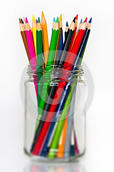 Glass full of sharpened wooden color pencils