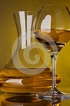 Glass full of wine and wine decanters photo