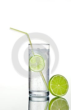 Glass of gin and tonic with ice and lime photo
