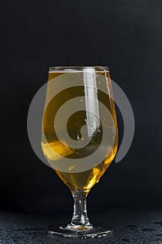 a glass glass with an alcoholic drink in close-up