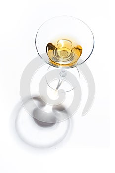 Glass glasses with drinks of different colors on a white background. Top view. The concept of an alcoholic cocktail