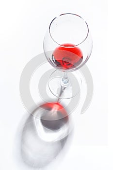 Glass glasses with drinks of different colors on a white background. Top view. The concept of an alcoholic cocktail