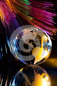 Glass Globe against Fiber Optic Background