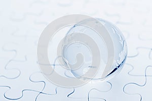 Glass globe ball on puzzle
