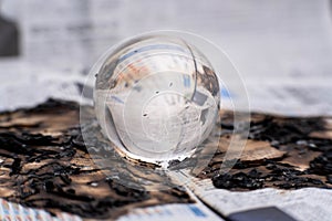 Glass globe on fire. Planet Earth Burning. Global Warming and Climate Change Concept