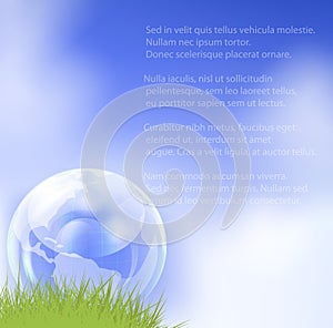 Glass globe in fresh green grass.