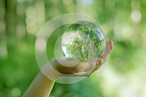 Glass globe in the hand