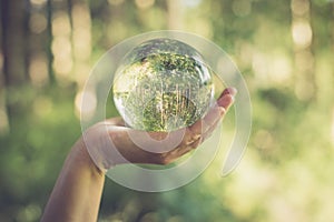 Glass globe in the hand