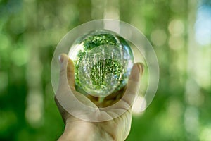 Glass globe in the hand