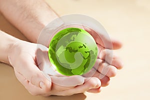 Glass globe in hand