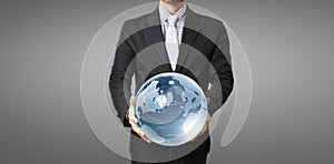 Glass globe in hand, Energy saving concept, Elements of image furnished by NASA