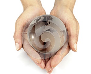 Glass globe in hands