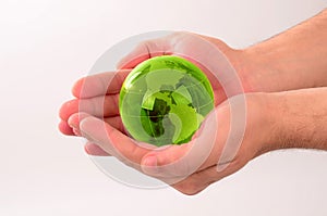 Glass globe in human hand