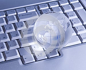Glass globe on keyboard