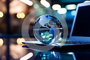 Glass globe and laptop combine in a business concept for a global perspective