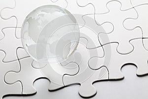 Glass globe with puzzle background