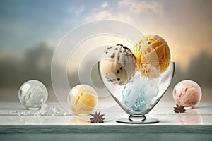 Glass goblet with multi-colored balls of ice cream with balls on the table against the sky. AI generated