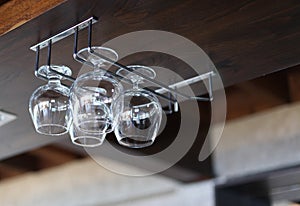 Glass goblets in interior wood alcoholic bar