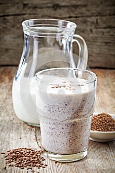 Glass of greek yogurt with crushed flax seeds