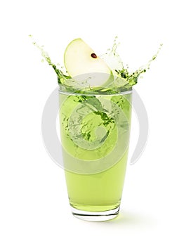 Glass of Green apple juice splash with sliced apple