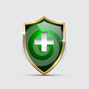 Glass Green Shield with golden frame and White Cross isolated on gray. Vector Health Protection icon.