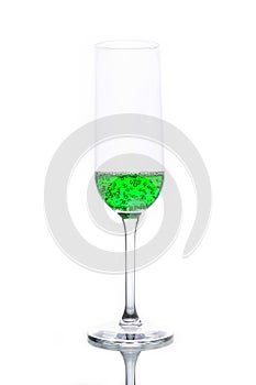 Glass with green sparkling water