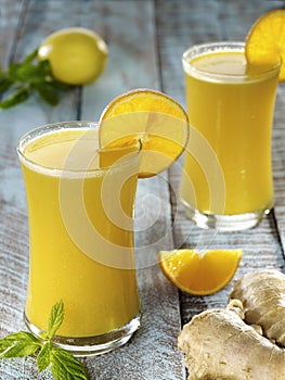 Glass of healthy orange juice and ginger